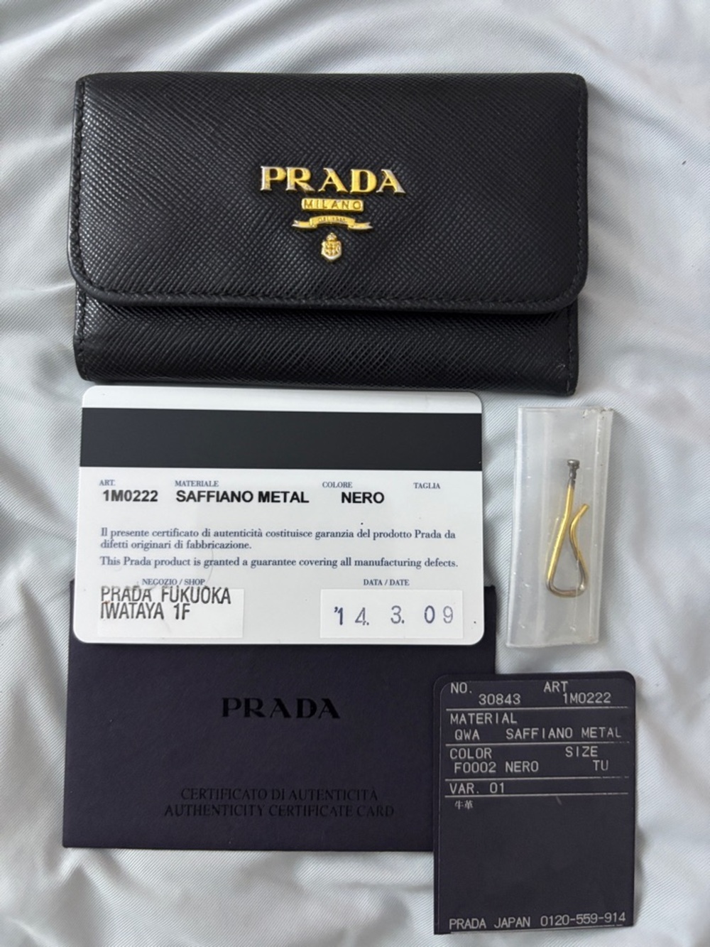 Authentic Prada Black Saffiano Leather Trifold Wallet with Gold Logo key holder